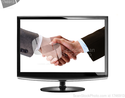 Image of handshake in LCD monitor