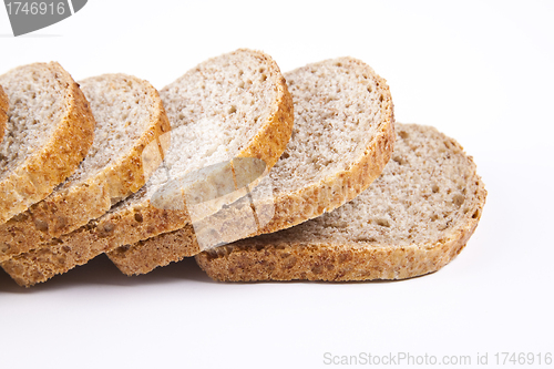 Image of The cut loaf of bread with reflaction isolated on white