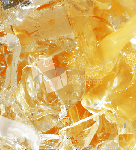 Image of orange juice with ice cubes