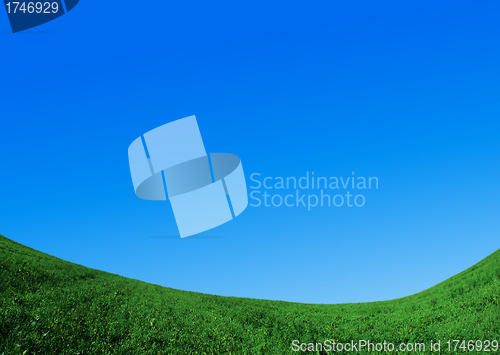 Image of green field and blue sky
