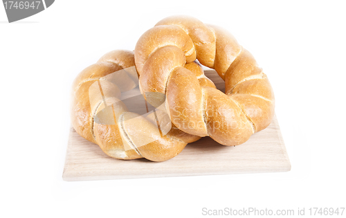 Image of buns isolated on wooden plate