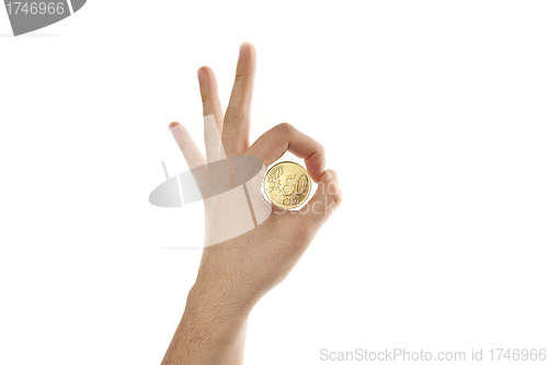 Image of Hand ok sign and 50 cent coin