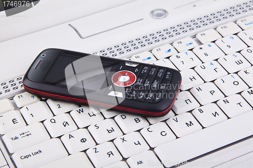 Image of keyboard and mobile phone background