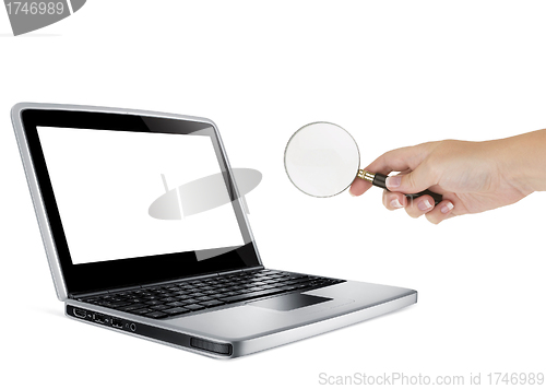 Image of Laptop with a magnify glass