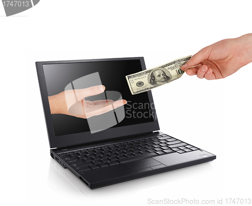 Image of hand giving some money from a laptop