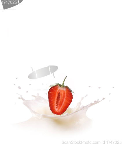 Image of Splash of milk, caused by falling into a ripe strawberry