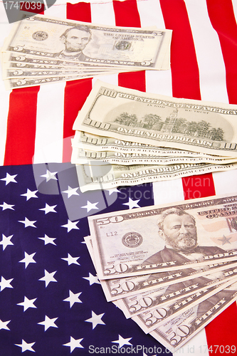 Image of US flag with dollars background