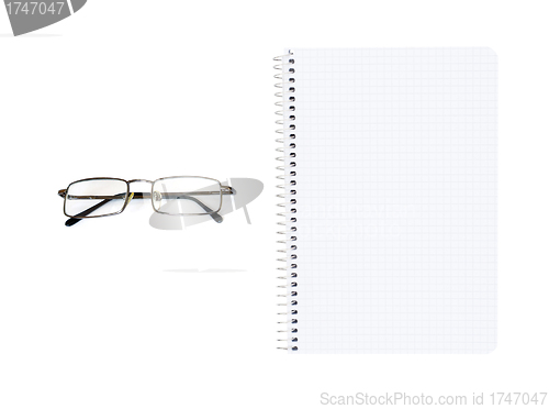 Image of notebook and eyeglasses