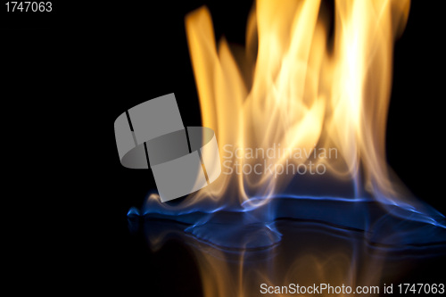 Image of Fire flames over black background texture