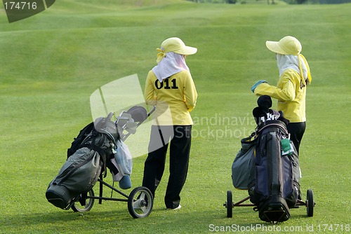 Image of Two caddies at a golf course
