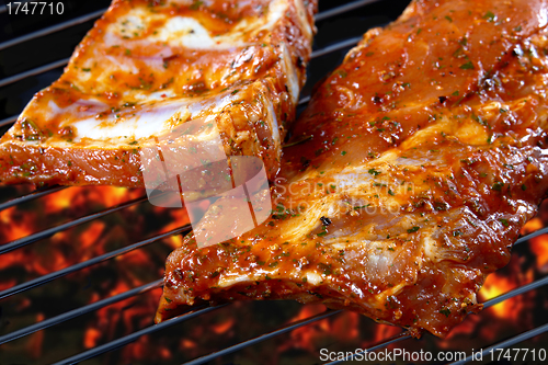 Image of raw pork ribs on grill