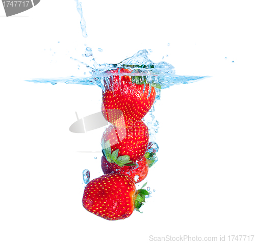 Image of Fresh Strawberry Dropped into Water with Splash