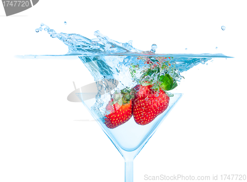 Image of Fresh Strawberry Dropped into Glass with Splash