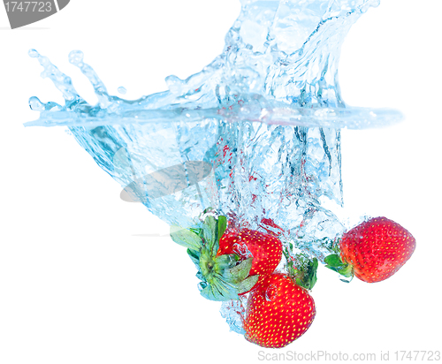 Image of Fresh Strawberry Dropped into Water with Splash