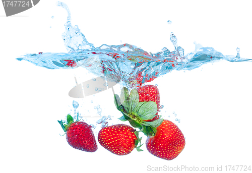 Image of Fresh Strawberry Dropped into Water with Splash