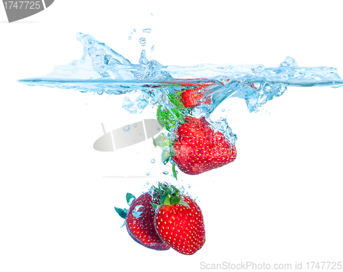 Image of Fresh Strawberry Dropped into Water with Splash
