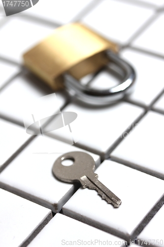 Image of padlock with key