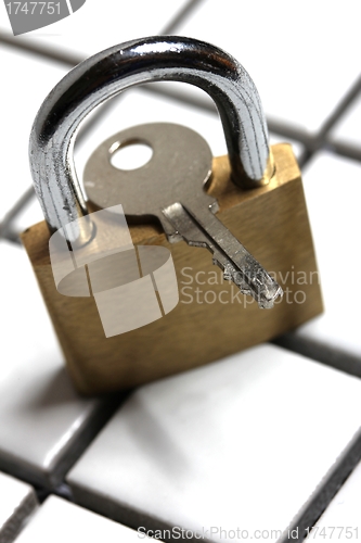 Image of padlock with key