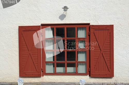 Image of Red window on white wall