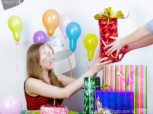 Image of Birthday. The girl accepts gifts