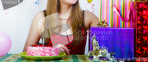 Image of Birthday. Girl with cake and gifts