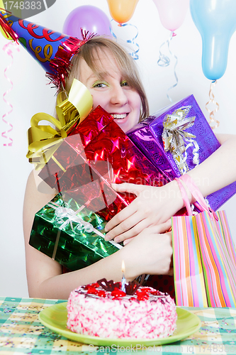 Image of Birthday. Happy girl with gifts