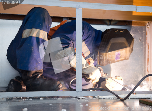 Image of Welder working in cramped conditions