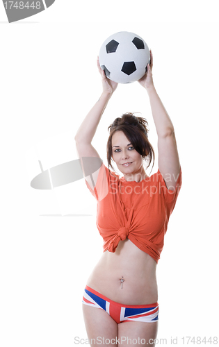 Image of woman holding soccer ball