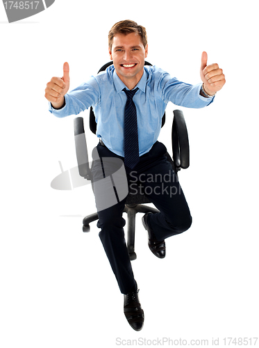 Image of Male executive showing double thumbs up