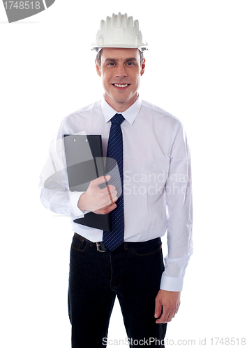 Image of Young architect holding clipboard