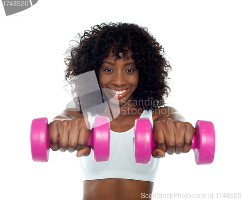 Image of Portrait of curly haired african fit woman