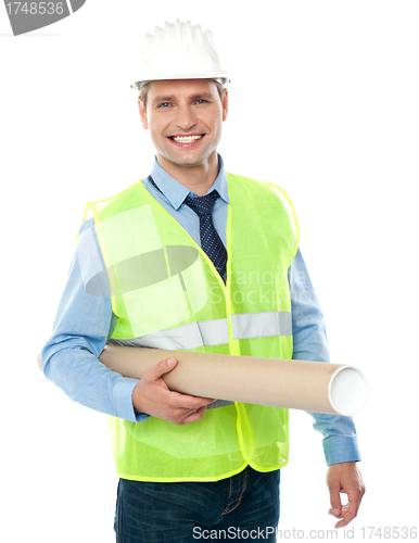 Image of Young architect holding construction map