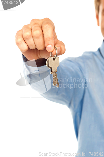 Image of Man holding keys. Shallow DOF