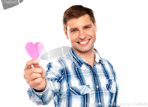 Image of Man showing pink paper heart