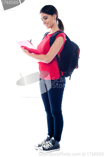 Image of Pretty cheerful attractive college girl