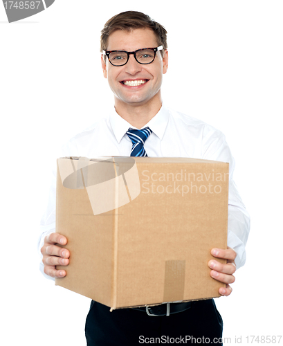 Image of Businessman holding packed carton