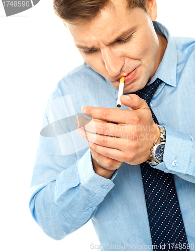 Image of Handsome businessman with a cigarette