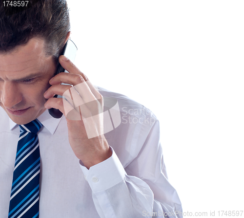 Image of Cropped image of man talking on cell phone