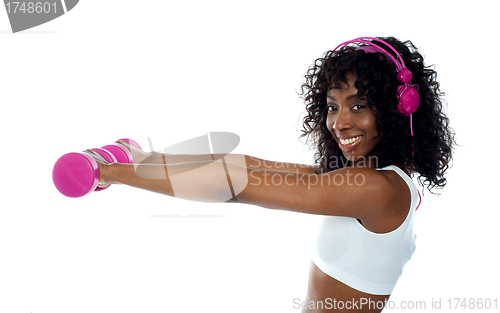 Image of Teenager listening to music and exercising