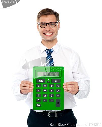 Image of Male executive displaying green calculator