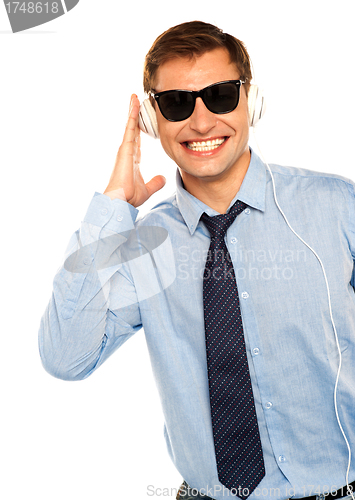 Image of Guy wearing sunglasses and listening to music