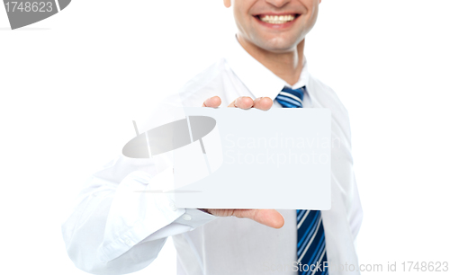 Image of Cropped image of man showing business card