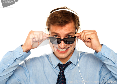 Image of Musical guy peeping from sunglasses