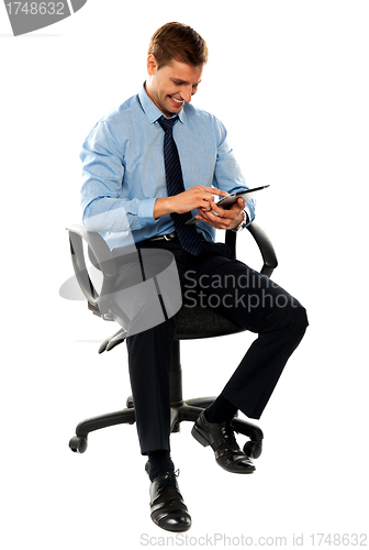 Image of Full length shot of seated entrepreneur