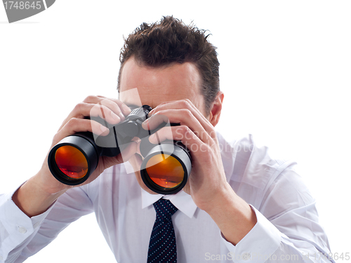 Image of Businessman looking through binoculars