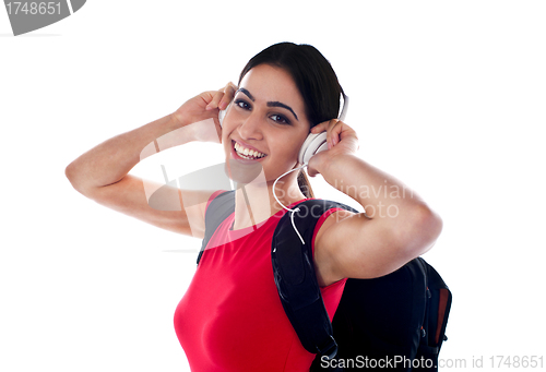 Image of Trendy casual girl listening to music