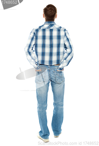 Image of Rear view of casual male looking upwards