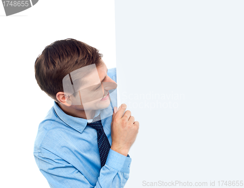 Image of Male executive holding blank whiteboard