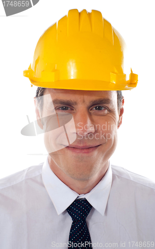 Image of An architect wearing yellow safety helmet