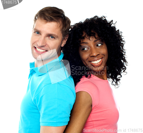 Image of Closeup shot of young couple. Back to back